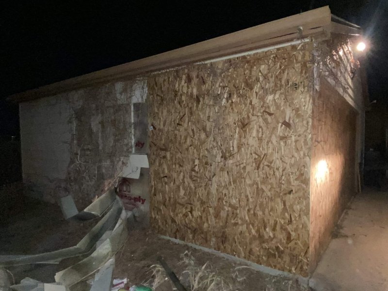After: the openings boarded up and secured