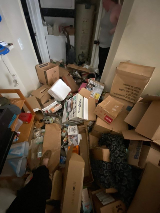 Room packed floor to ceiling before hoarding cleanup