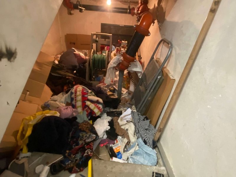 Before: a closet packed with debris from an encampment cleanout
