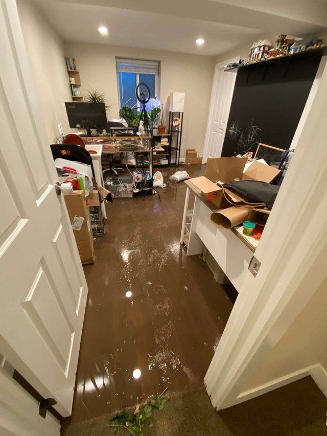 Standing water and damage inside a home before cleanup